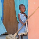 Haitian girl with broom